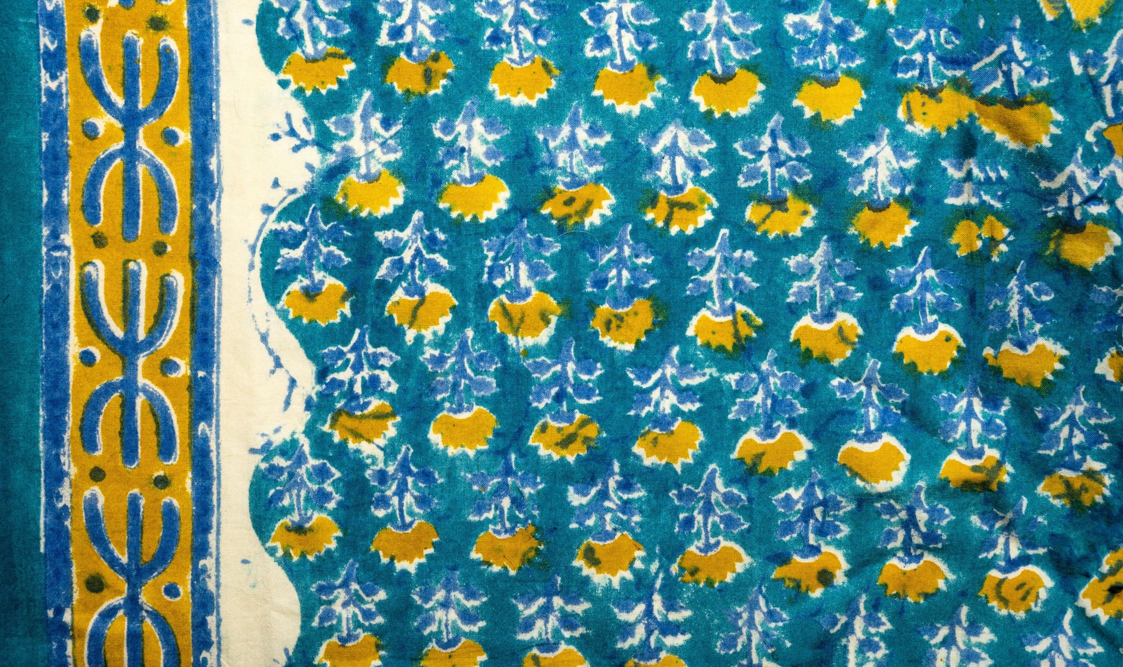 Turquoise blue Indian block-printed fabric detail